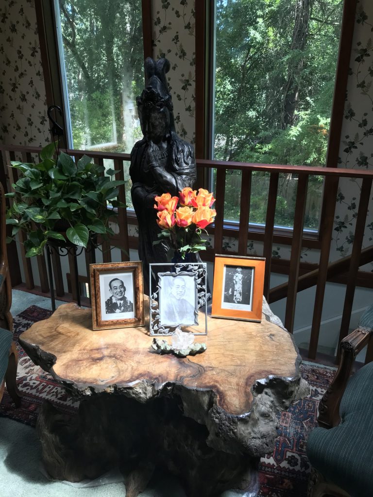 Table with photos of Reiki Master Mikao Usui